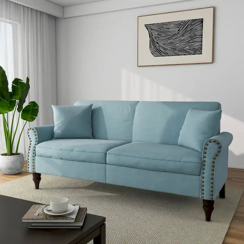 Canapé avec accoudoirs arrondis et clous décoratifs