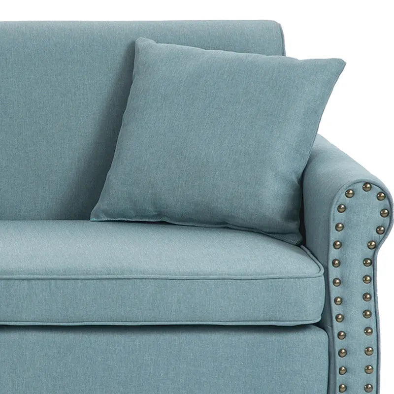 Canapé avec accoudoirs arrondis et clous décoratifs